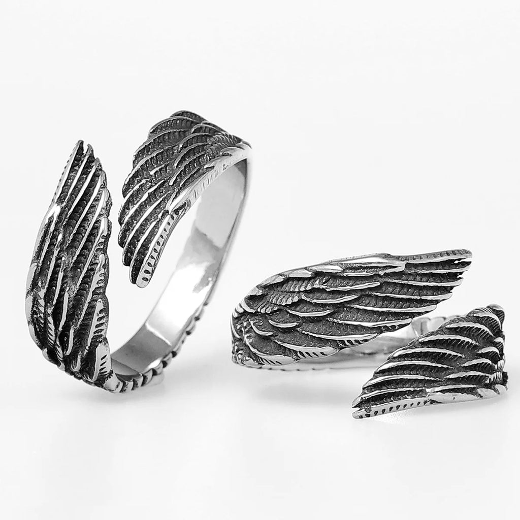 Silver angel wing-shaped rings on a white background