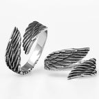 Silver angel wing-shaped rings on a white background