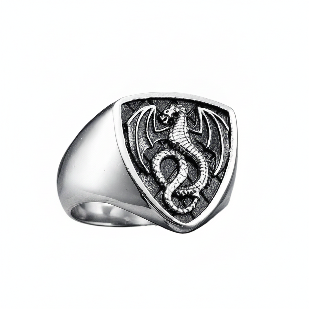 Silver ring with dragon design on a white background