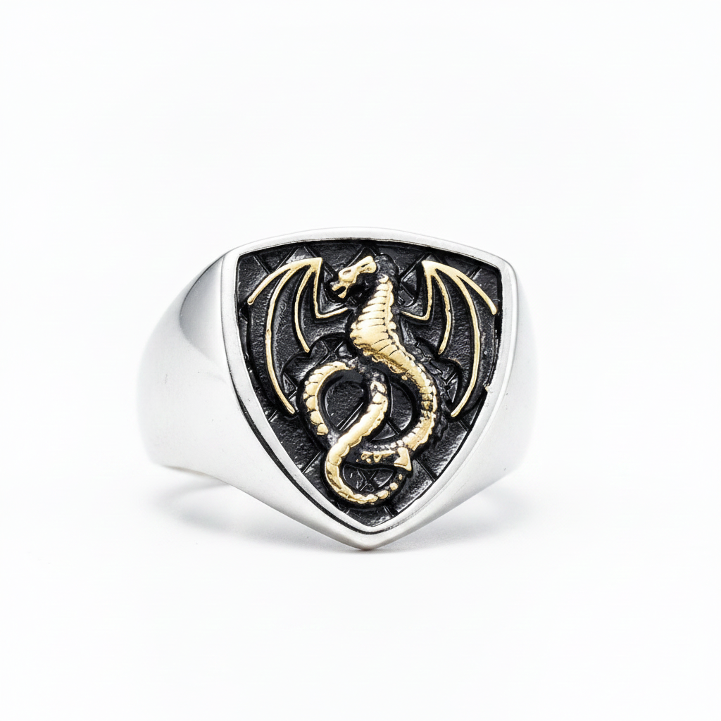 silver an gold ring with dragon design on a white background