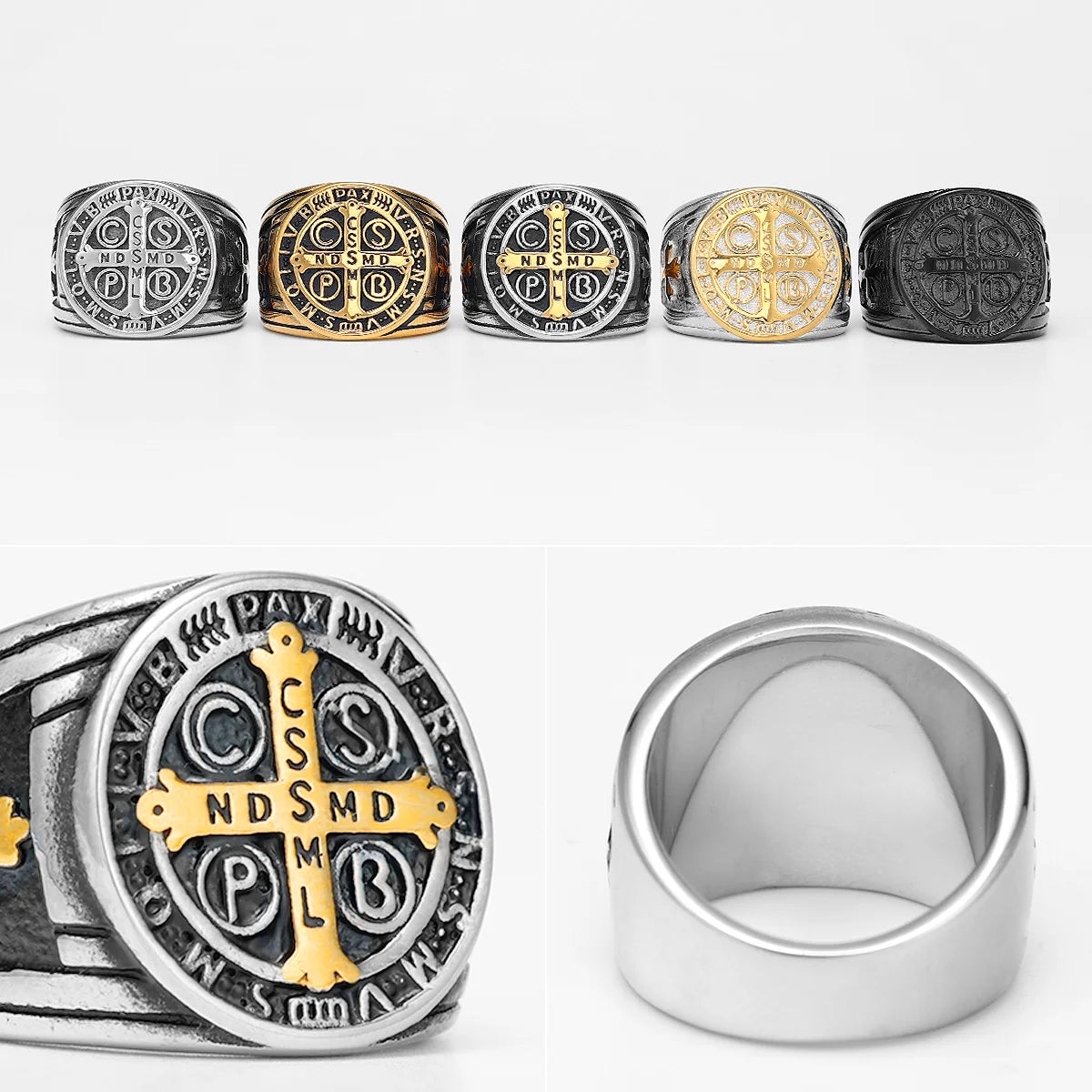Collection of silver, gold, and black rings with religious symbols on a white background