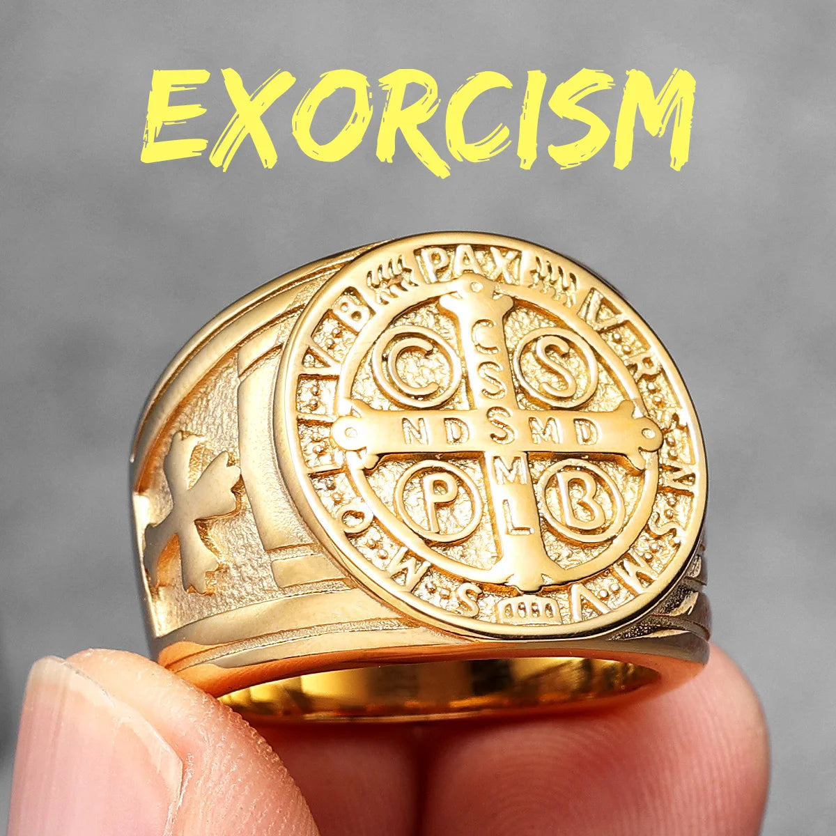 Gold ring with religious symbols held by a hand against a grey background with 'EXORCISM' text.