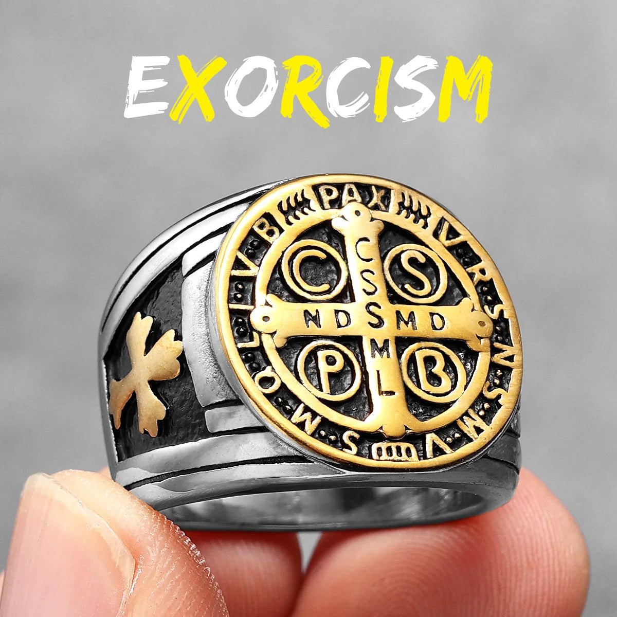 Gold and silver ring with religious symbols held by a hand, against a grey background with 'EXORCISM' text.