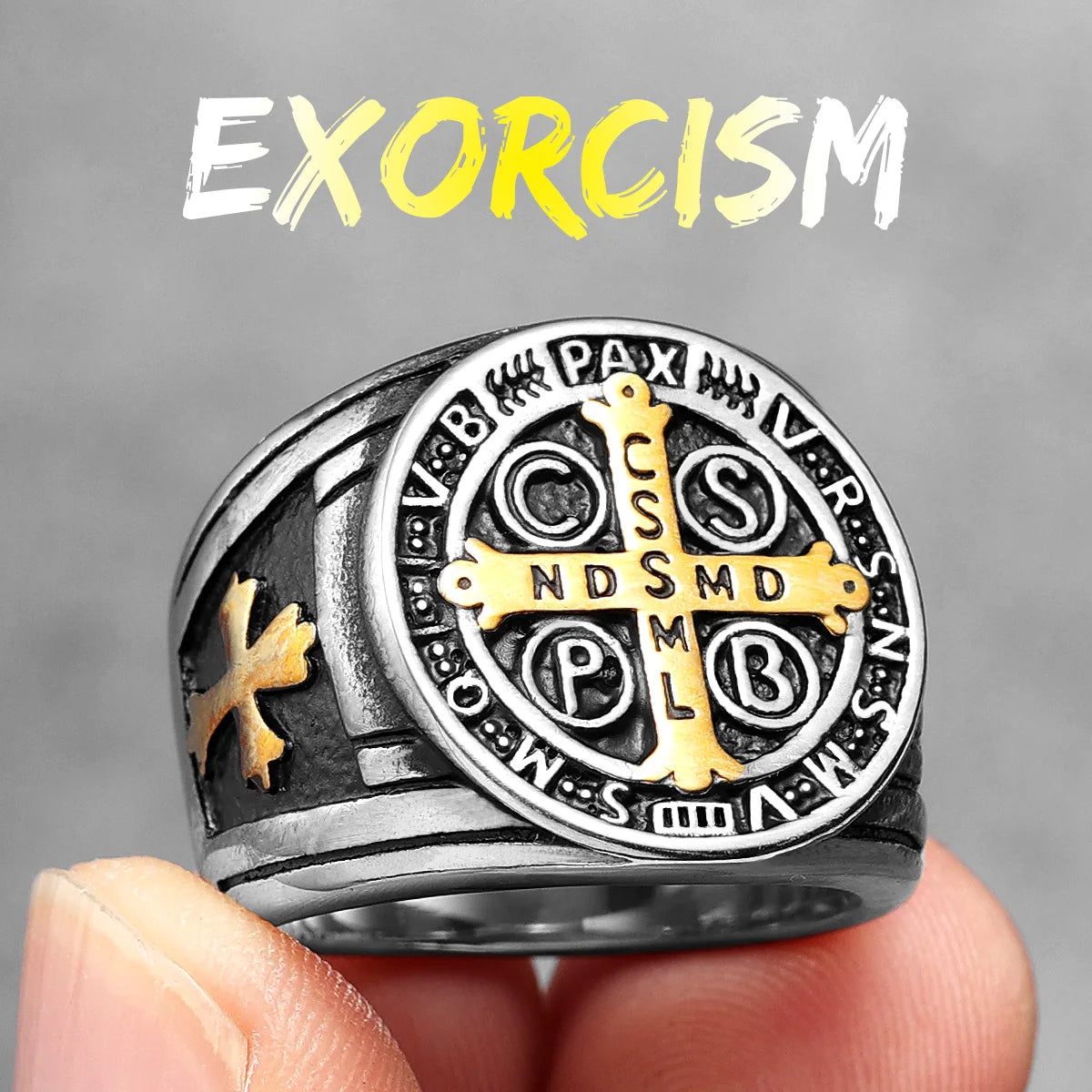 Silver and gold ring with religious symbols held by a hand against a grey background, with 'Exorcism' text above.
