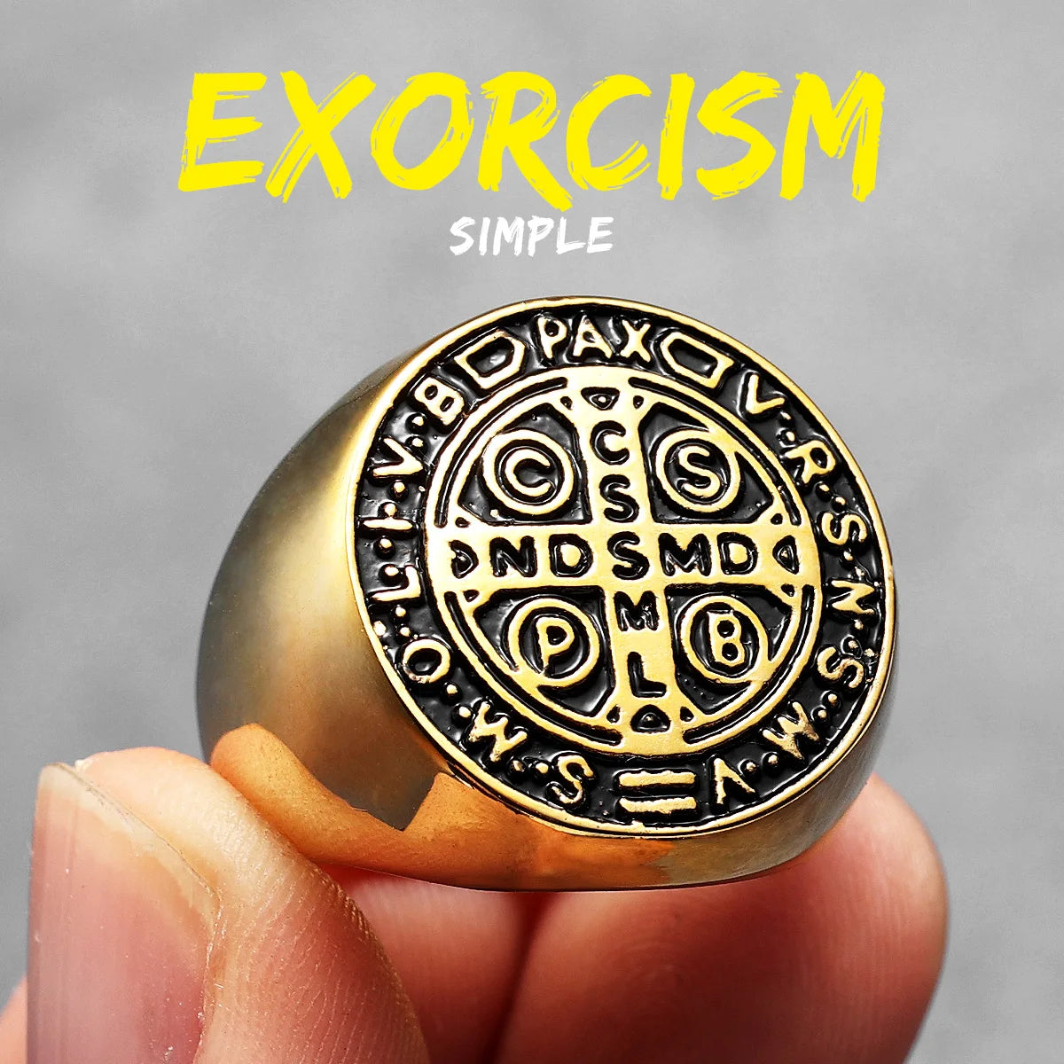 Gold ring with intricate design held by a hand against a grey background, with 'Exorcism Simple' text above.