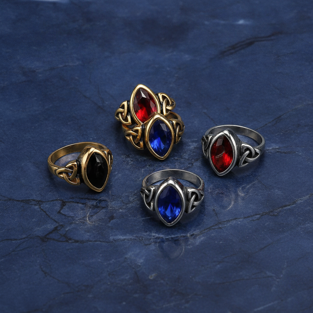 Elven styled rings with coloured gemstones on a textured blue marble  background