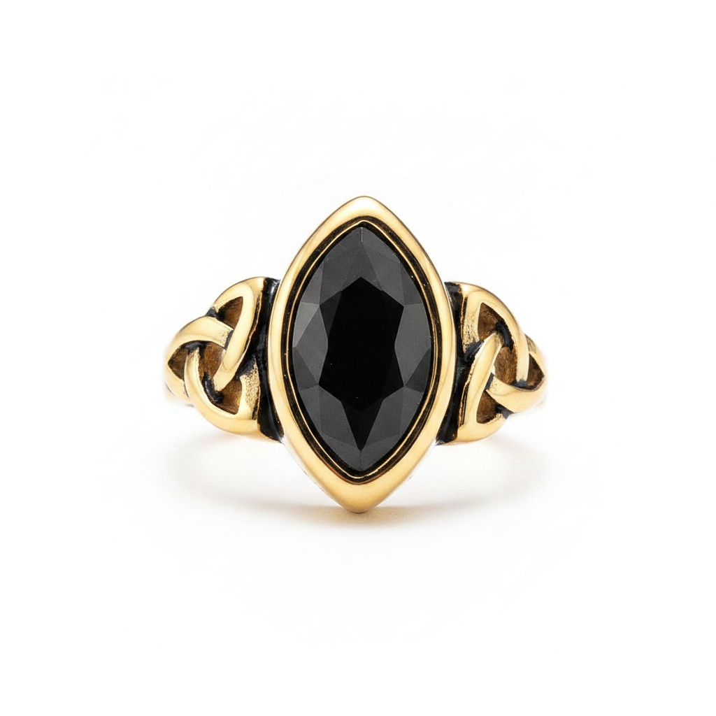 Gold elven themed ring with a black gemstone on a white background