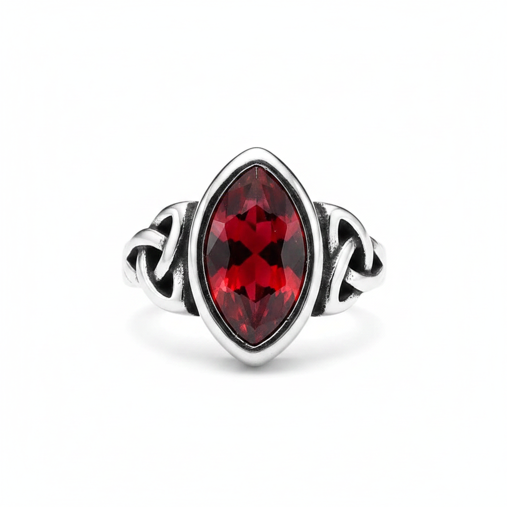 Silver elven themed ring with a red gemstone on a white background