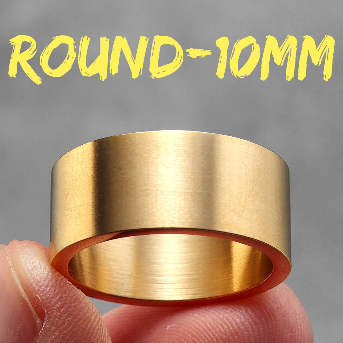 Gold ring held between fingers with 'ROUND-10MM' text in yellow above it on a grey background