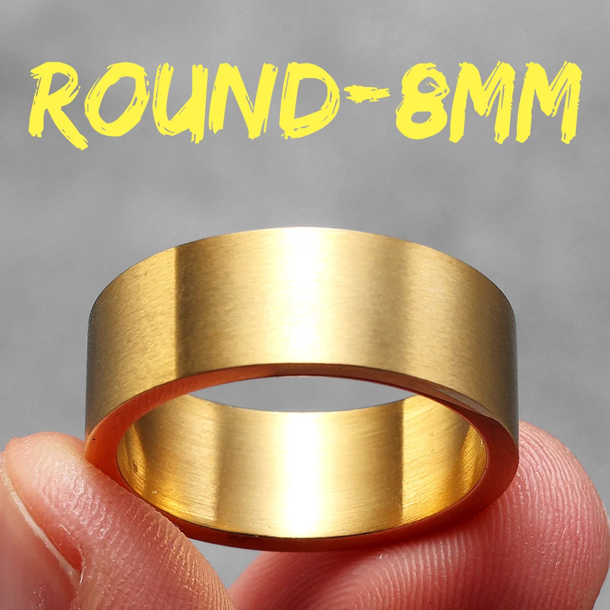 Gold ring held between fingers with 'ROUND-8MM' text above on a grey background