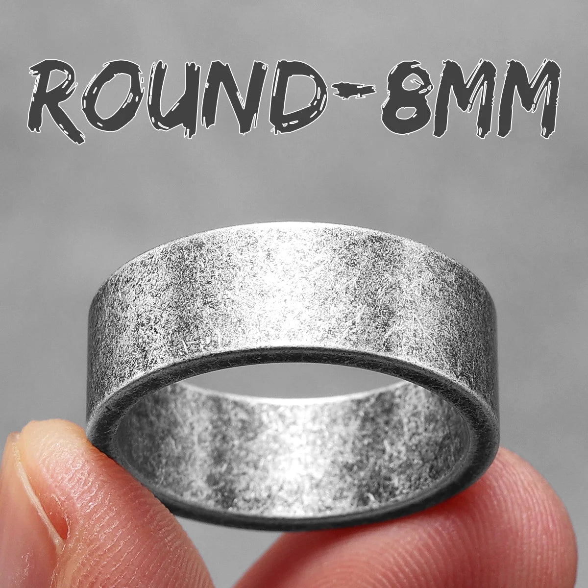 Silver ring held between fingers with 'ROUND-8MM' text above on a grey background