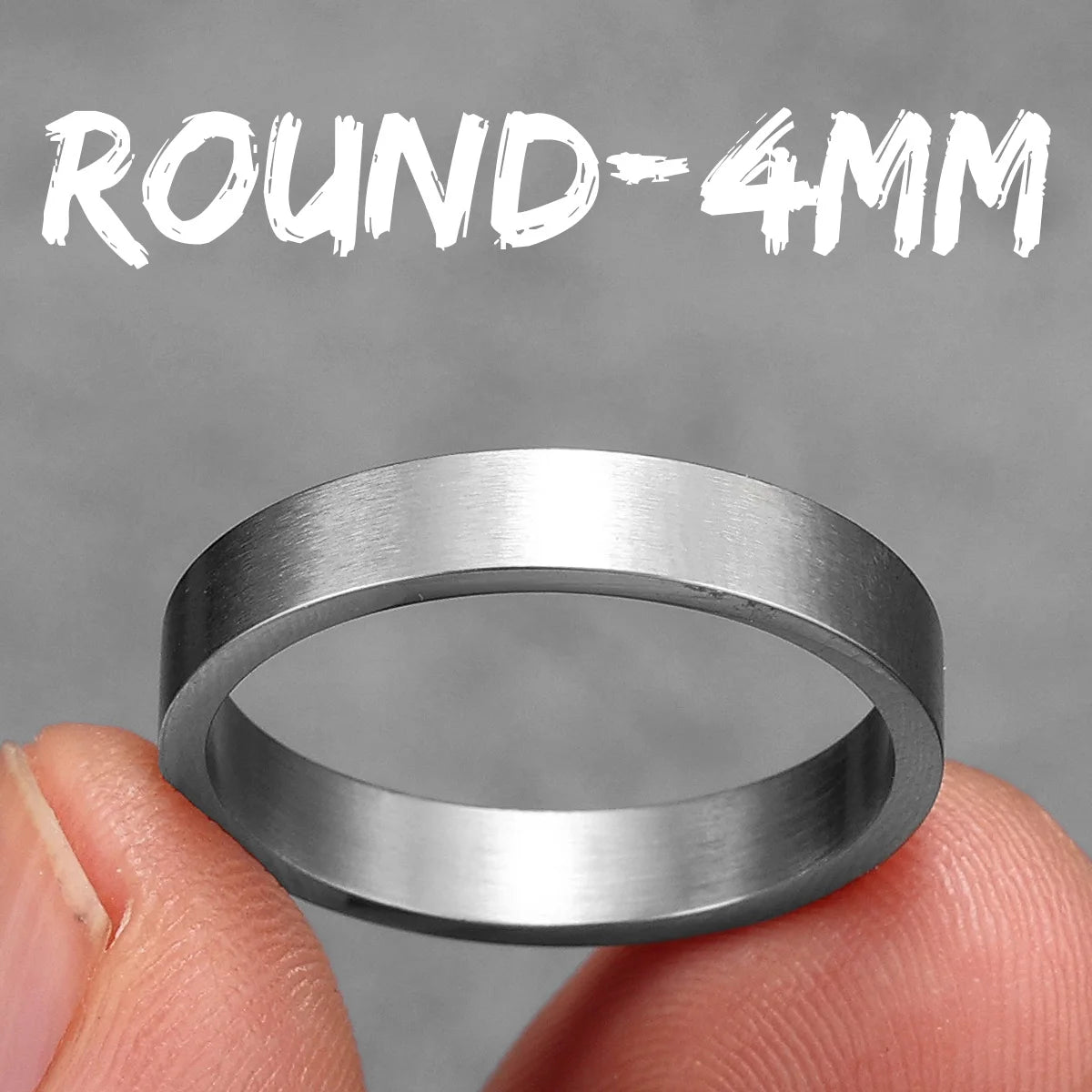 Silver ring held between fingers with 'ROUND-4MM' text on a grey background