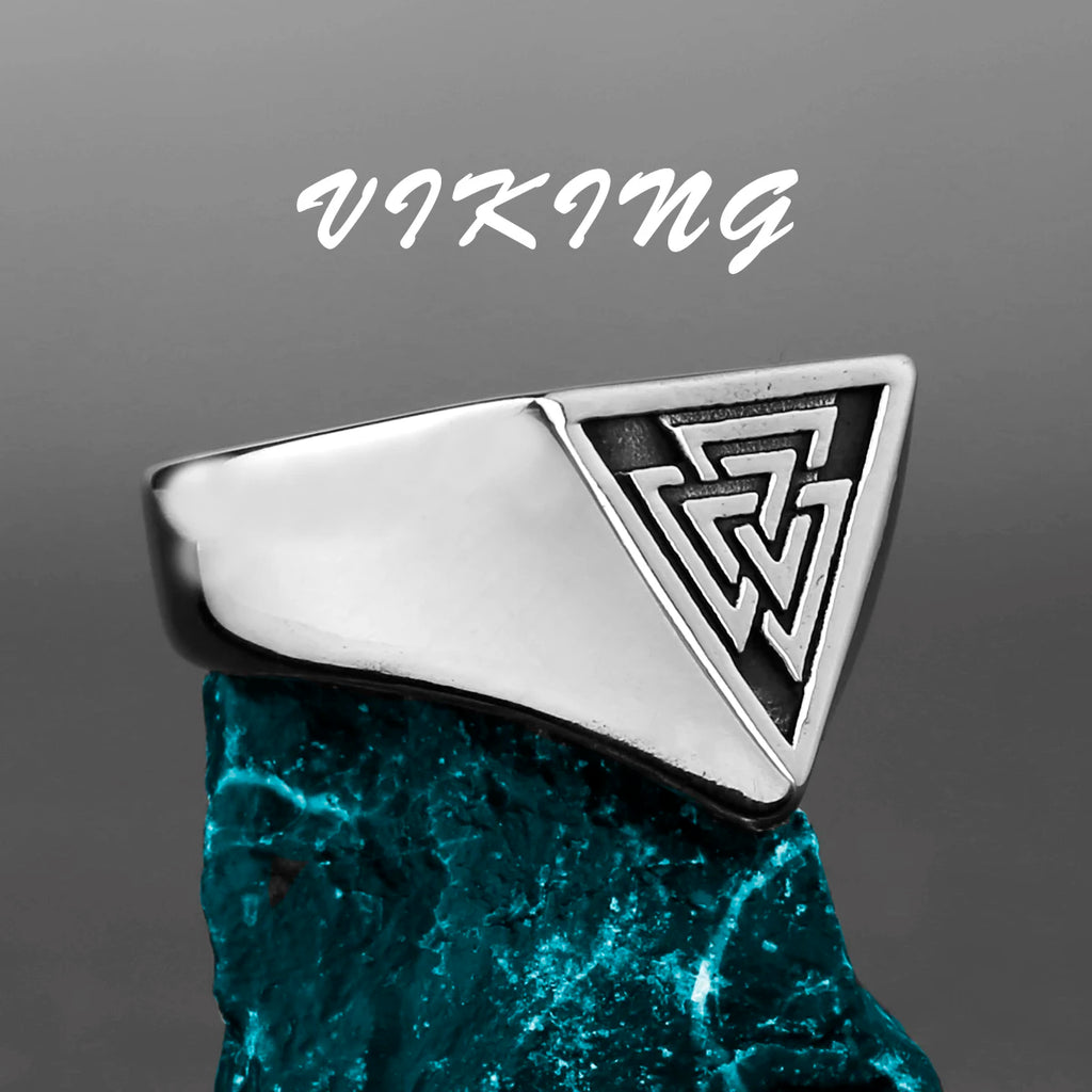 Silver signet ring with geometric design on a grey background, featuring the word 'Viking'.