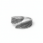 Silver stainless steel ring with feather design on a white background