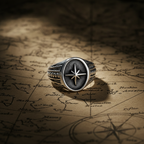 Silver ring with a star design on an old map background