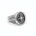 Silver ring with star design on a white background