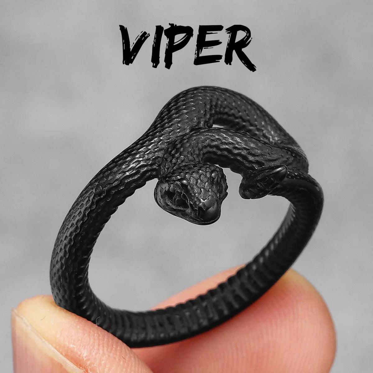 Black snake-shaped ring held in a hand with a grey background and 'Viper' text above.