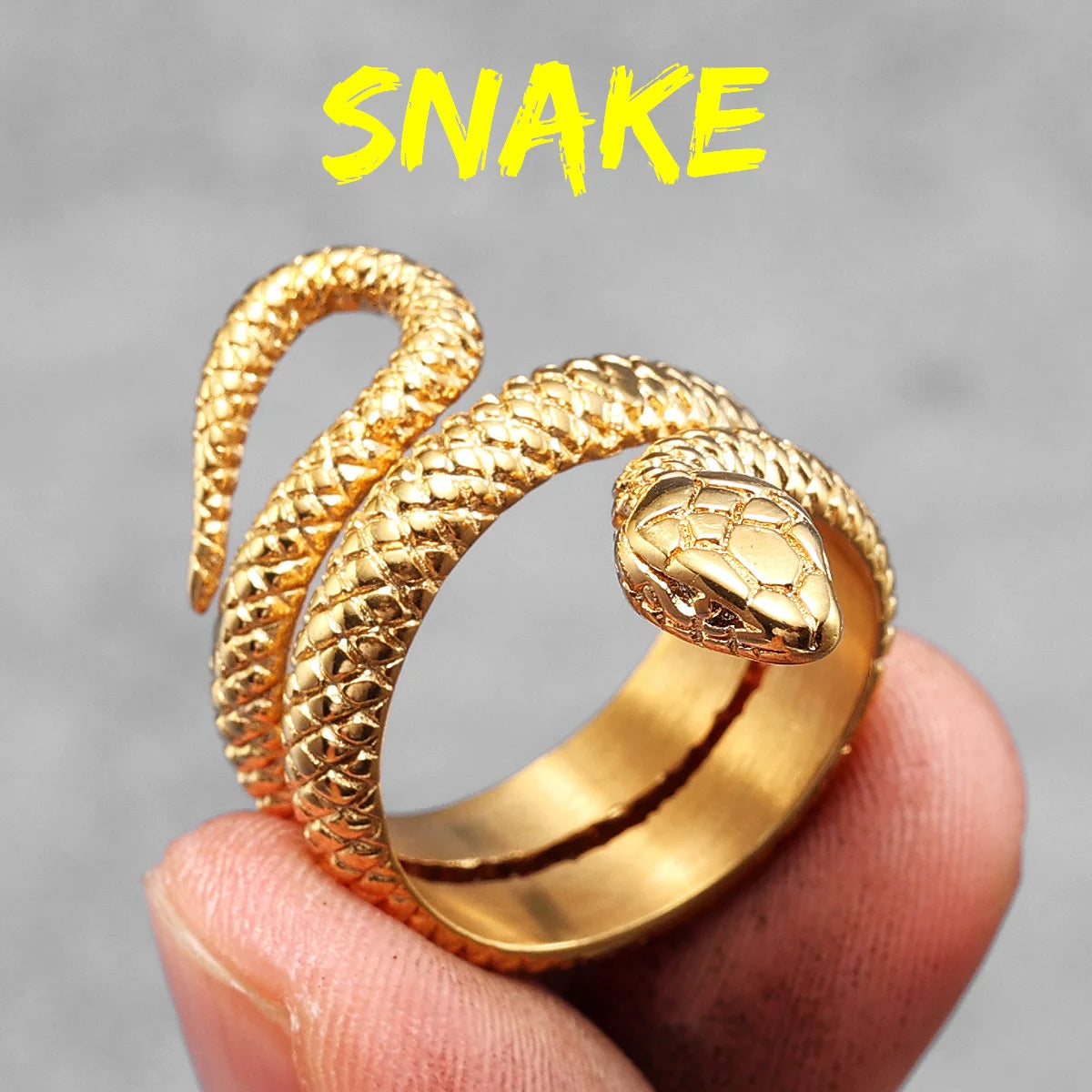 Gold snake-shaped ring on a finger with 'Snake' text above.