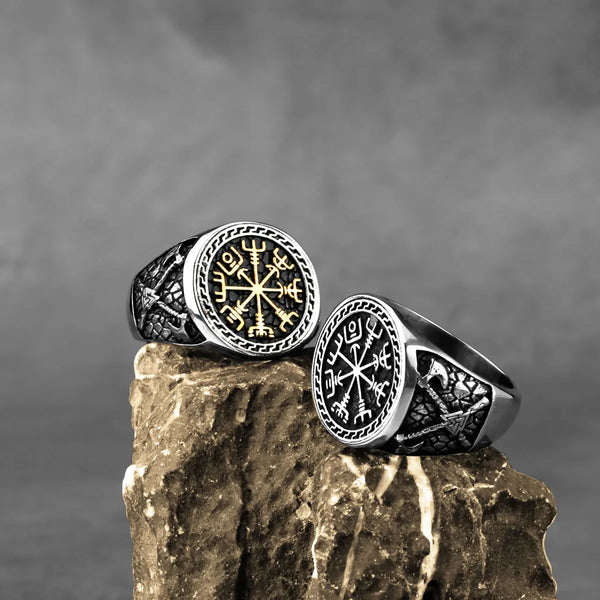 Viking rings on a brown rock showing engraved Norse compass