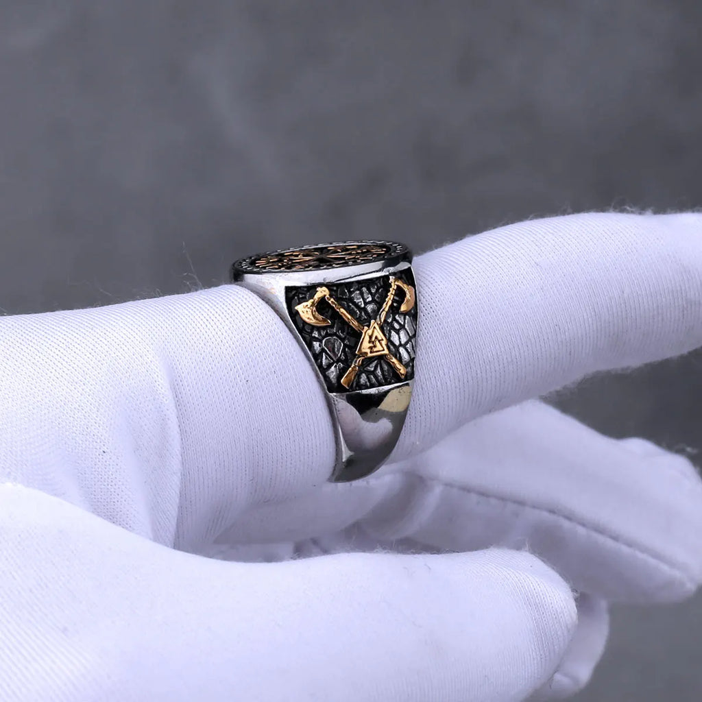 Viking ring with gold colour on a white glove