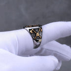 Viking ring with gold colour on a white glove