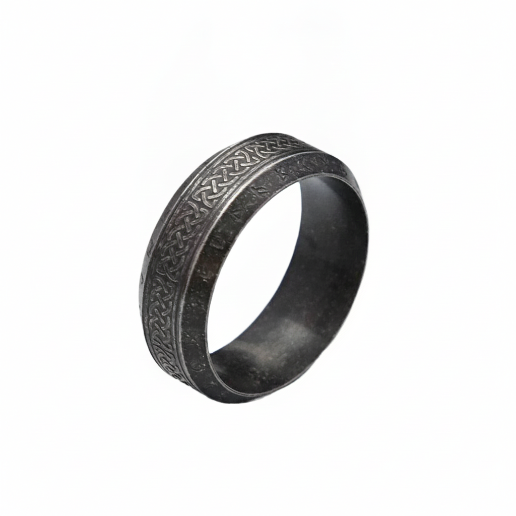 Decorative black ring with intricate Norse Viking patterns on a white background