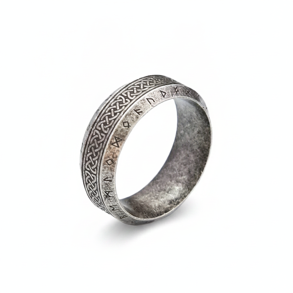 Silver ring with intricate Norse Viking design on a white background