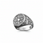Silver ring with intricate design on a white background