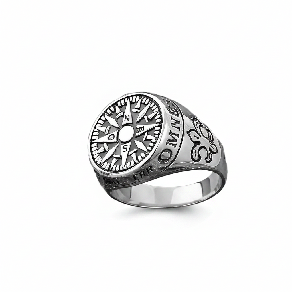Silver ring with intricate design on a white background