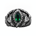Silver serpent's ring with green gemstone on a white background