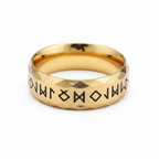 Gold stainless steel runic Viking styled ring on a white background