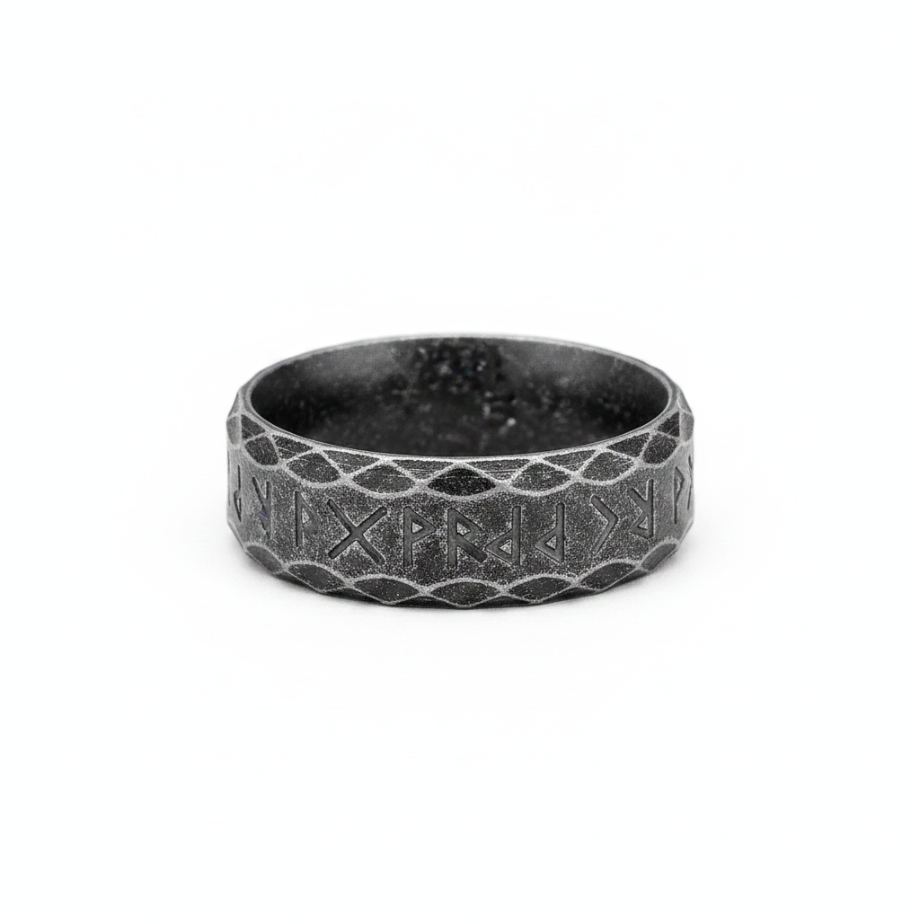Vintage black stainless steel runic Viking styled ring on a white background