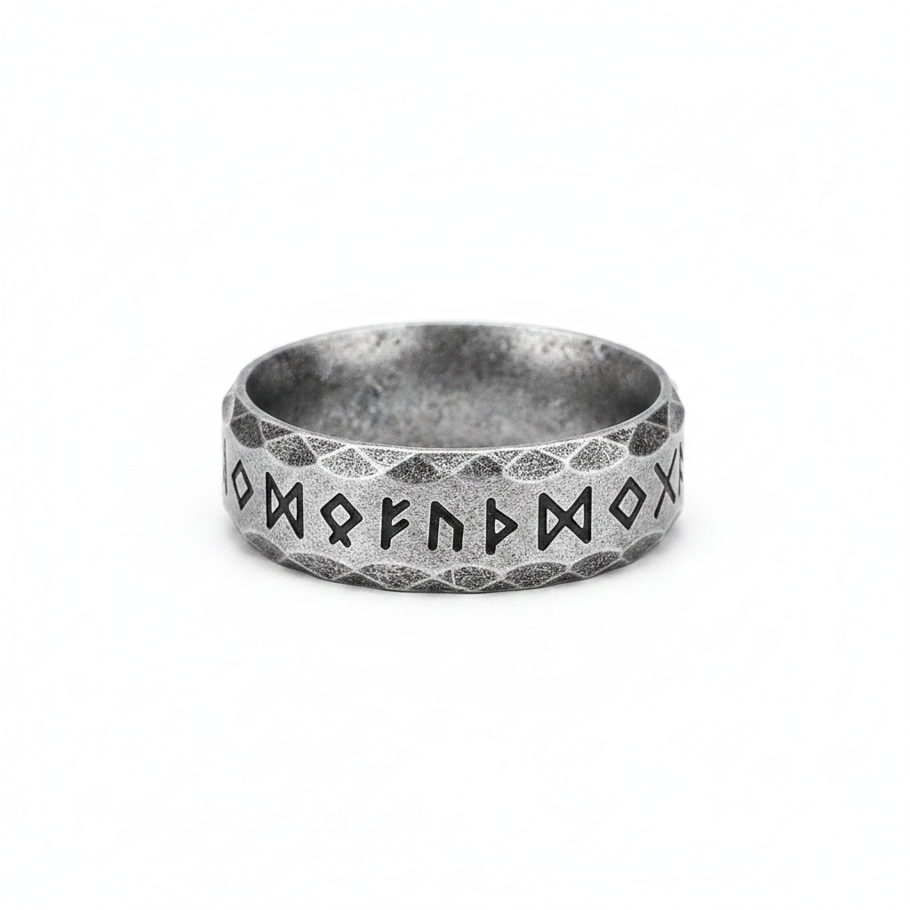 Vintage silver stainless steel runic Viking styled ring on a white background