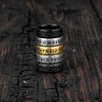 rings with Noridc Runes on a textured dark surface